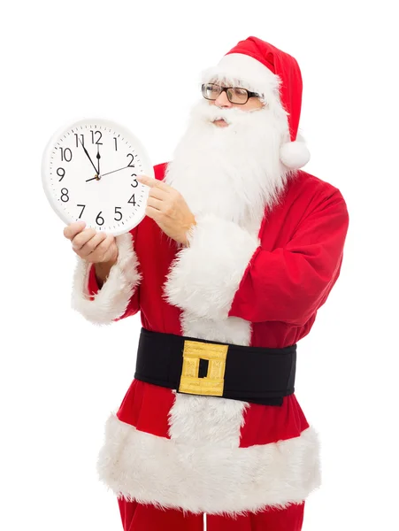 Homme en costume de Père Noël claus avec horloge — Photo