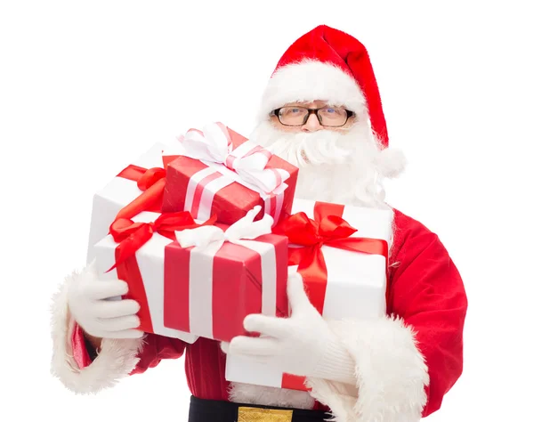 Man in costume of santa claus with gift boxes — Stock Photo, Image