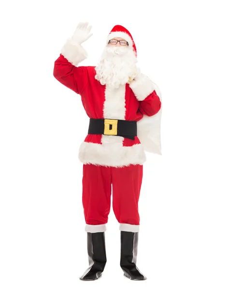 Man in costume of santa claus with bag — Stock Photo, Image