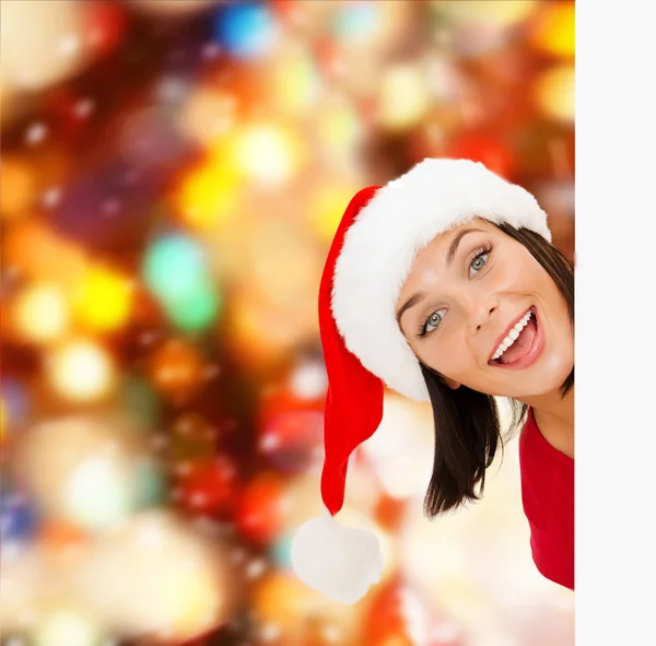 Frau mit Weihnachtsmann-Helfermütze mit weißem Brett — Stockfoto