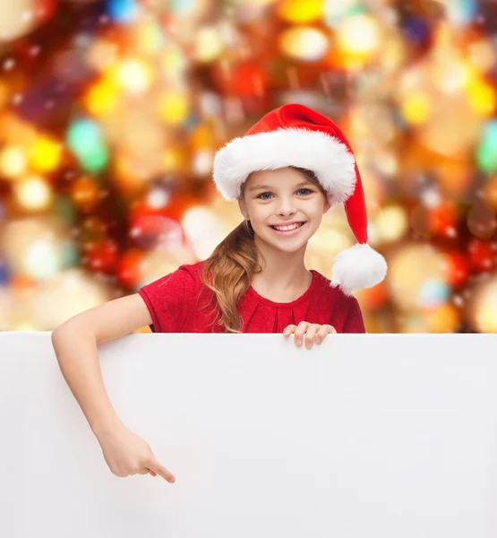 Fille dans santa helper chapeau avec tableau blanc vierge — Photo