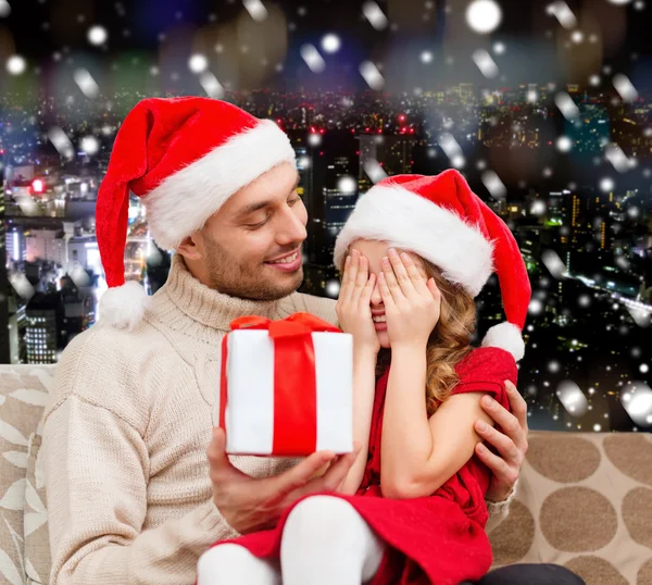Smiling daughter waiting for present from father — Stock Photo, Image