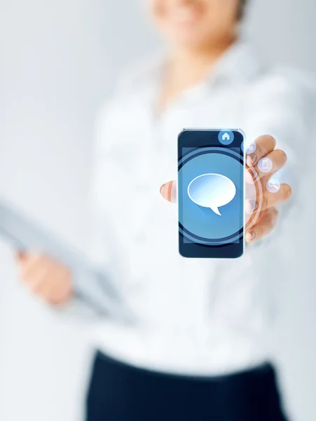 Close up of businesswoman showing smartphone — Stock Photo, Image