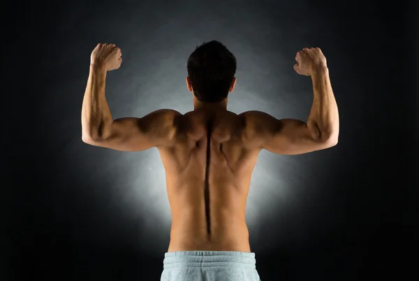 Young male bodybuilder from back — Stock Photo, Image