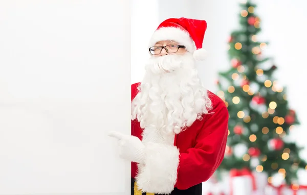 Homme en costume de Père Noël claus avec panneau d'affichage — Photo