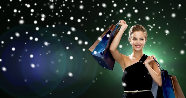 Smiling woman with shopping bags — Stock Photo, Image