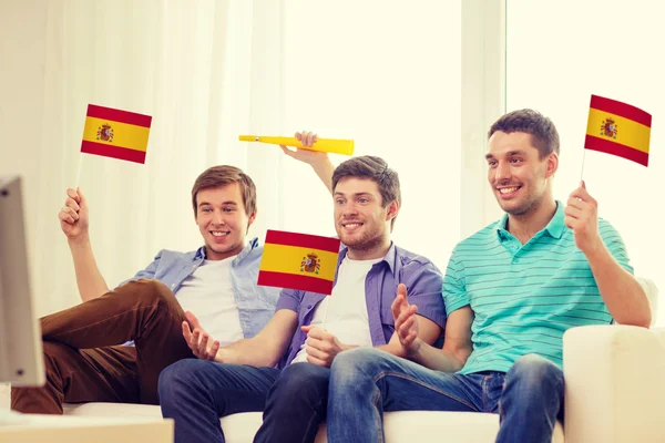 Happy male friends with flags and vuvuzela — Stock Photo, Image