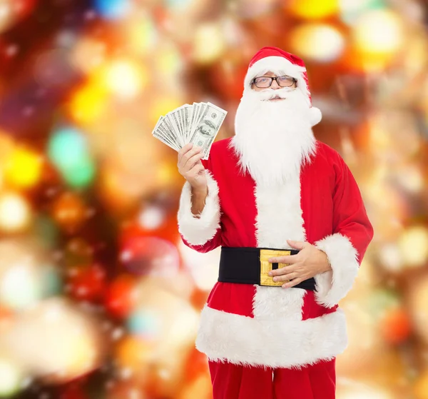 Mann im Kostüm des Weihnachtsmannes mit Dollargeld — Stockfoto