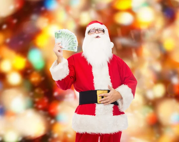 Man in costume of santa claus with euro money — Stock Photo, Image