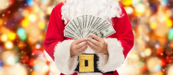 Close-up van de kerstman met dollar geld — Stockfoto