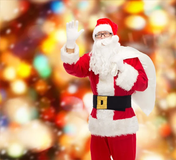 Man in kostuum van de kerstman met zak — Stockfoto