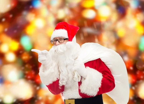 Man in costume of santa claus with bag — Stock Photo, Image