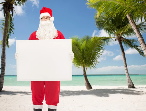 Uomo in costume di Babbo Natale con cartellone — Foto Stock