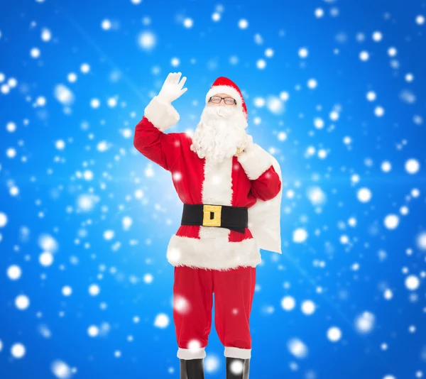 Man in costume of santa claus with bag — Stock Photo, Image