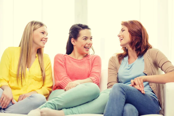 Three girlfriends having a talk at home Royalty Free Stock Images