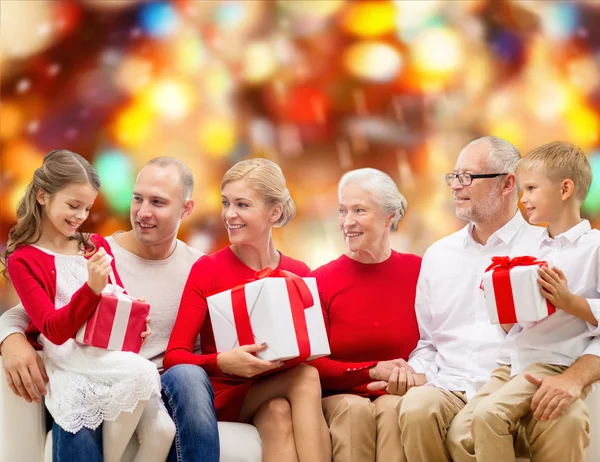 Smiling family with gifts — Stock Photo, Image