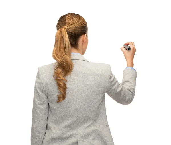 Businesswoman or teacher with marker from back — Stock Photo, Image