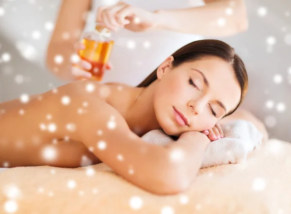 Beautiful young woman in spa salon getting massage — Stock Photo, Image