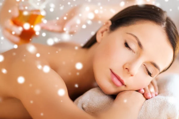 Beautiful young woman in spa salon getting massage — Stock Photo, Image