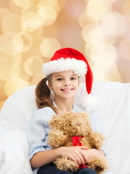 Smiling little girl with teddy bear — Stock Photo, Image