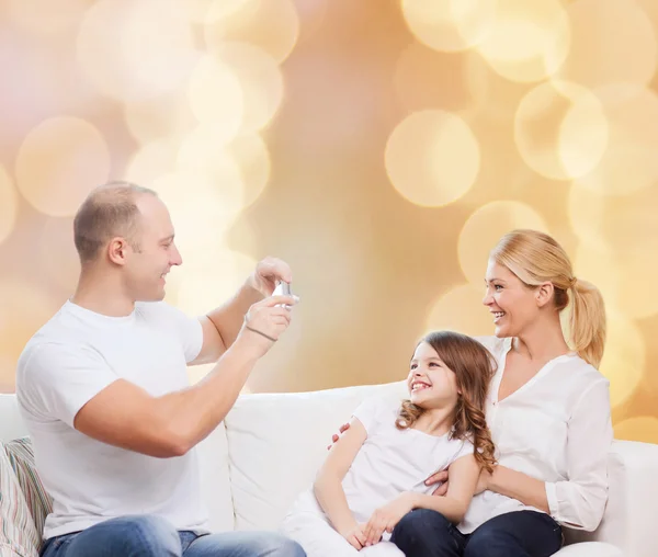 Happy family with camera at home — Stock Photo, Image