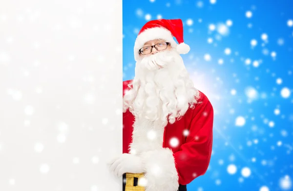 Man in costume of santa claus with billboard — Stock Photo, Image