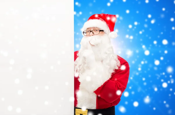 Man in costume of santa claus with billboard — Stock Photo, Image