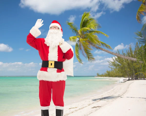 Homem em traje de santa claus com saco — Fotografia de Stock