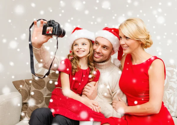 Happy family with digital camera taking photo — Stock Photo, Image