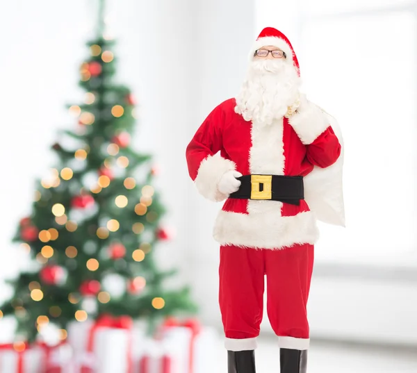 Man in costume of santa claus with bag — Stock Photo, Image