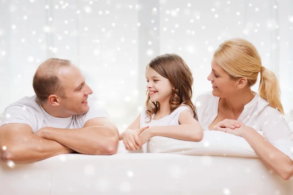 Smiling parents and little girl at home — Stock Photo, Image