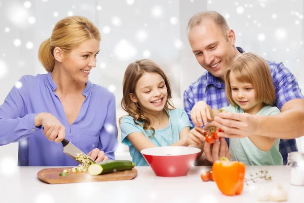 Happy family with two kids making dinner at home — Stock Photo, Image