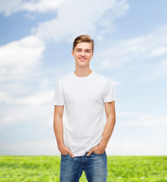 Smiling young man in blank white t-shirt — Stock Photo, Image