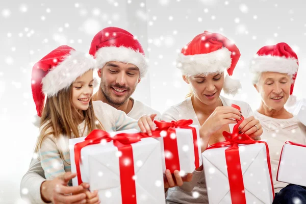 Happy family sitting on couch at home — Stock Photo, Image