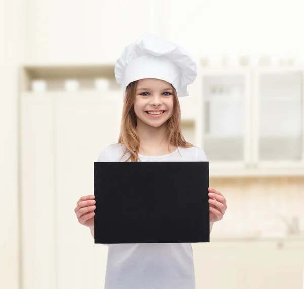 Pequeño cocinero o panadero con papel negro en blanco — Foto de Stock