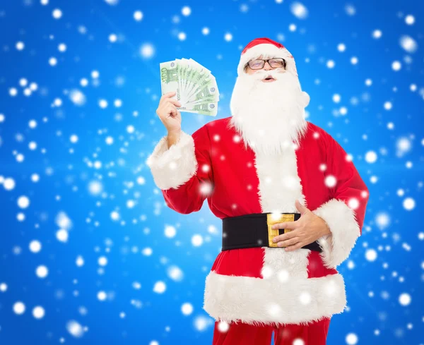 Man in costume of santa claus with euro money — Stock Photo, Image