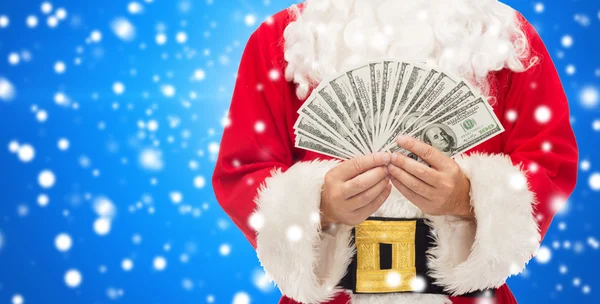 Primer plano de santa claus con dinero en dólares — Foto de Stock