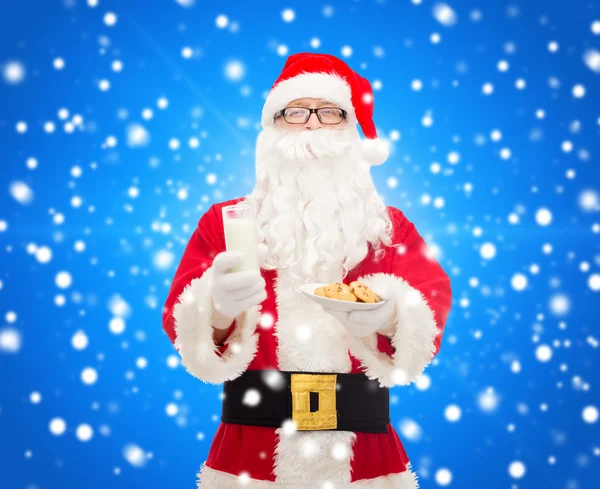 Santa claus with glass of milk and cookies — Stock Photo, Image