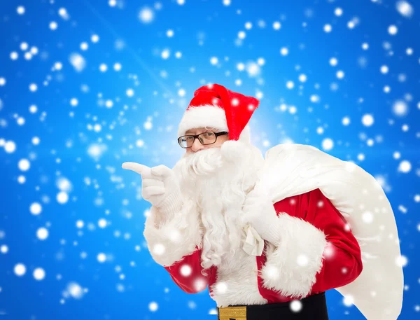 Man in costume of santa claus with bag — Stock Photo, Image