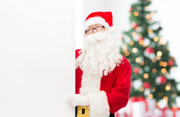 Man in costume of santa claus with billboard — Stock Photo, Image