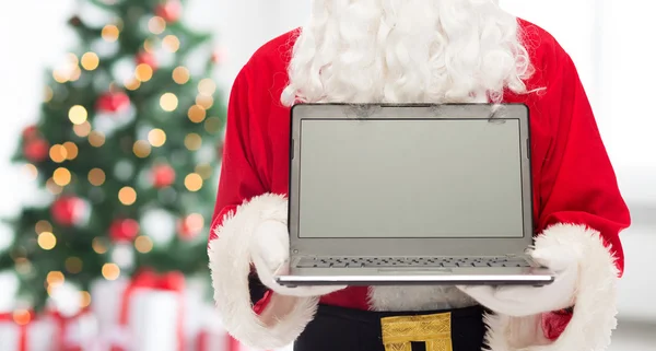 Close-up van de kerstman met laptop — Stockfoto