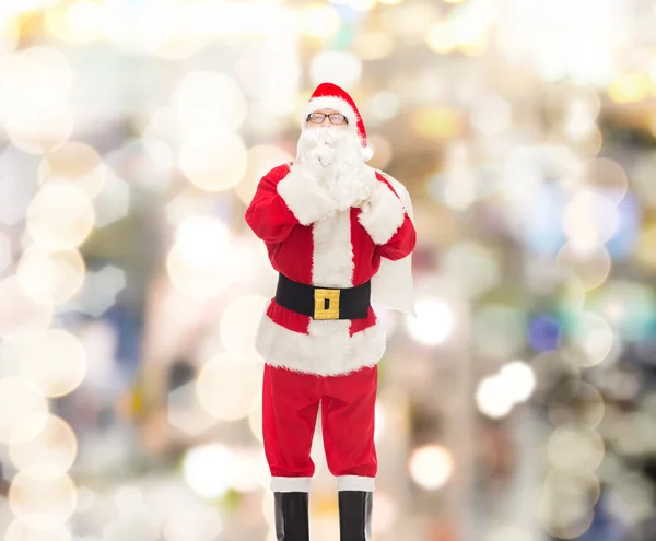 Homme en costume de Père Noël claus avec sac — Photo