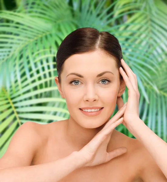 Smiling young woman with bare shoulders — Stock Photo, Image