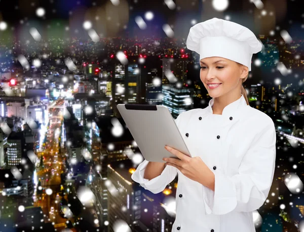 Smiling female chef with tablet pc computer — Stock Photo, Image