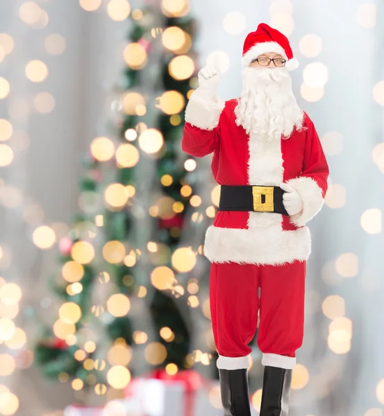 Man in costume of santa claus pointing finger up — Stock Photo, Image