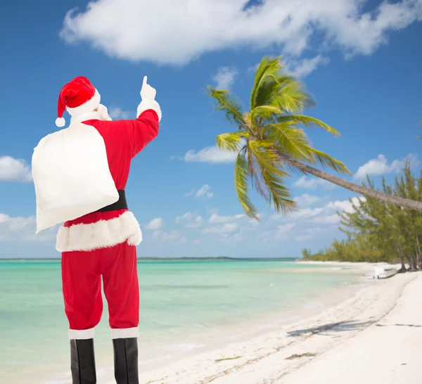 Homme en costume de Père Noël claus avec sac — Photo