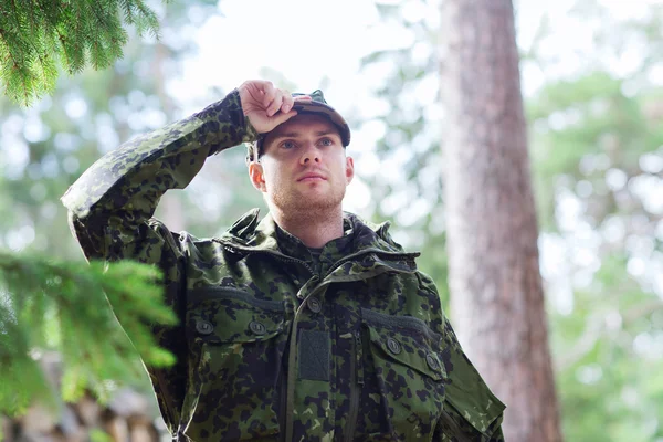 Young soldier or ranger in forest — Stock Photo, Image