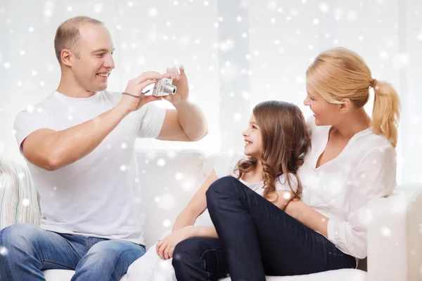 Happy family with camera taking picture at home — Stock Photo, Image