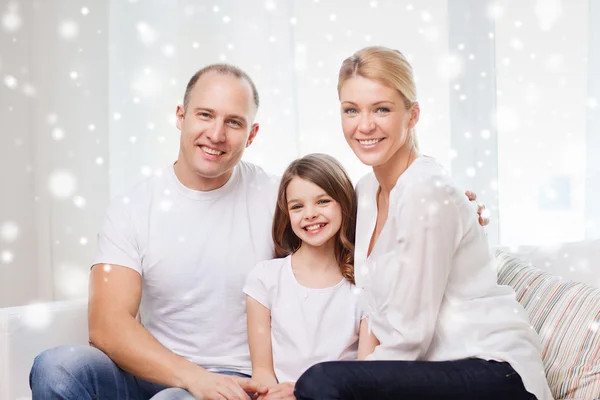 Smiling parents and little girl at home — Stock Photo, Image