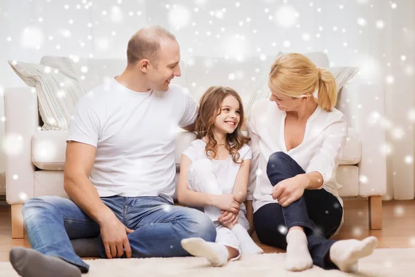 Smiling parents and little girl at home — Stock Photo, Image